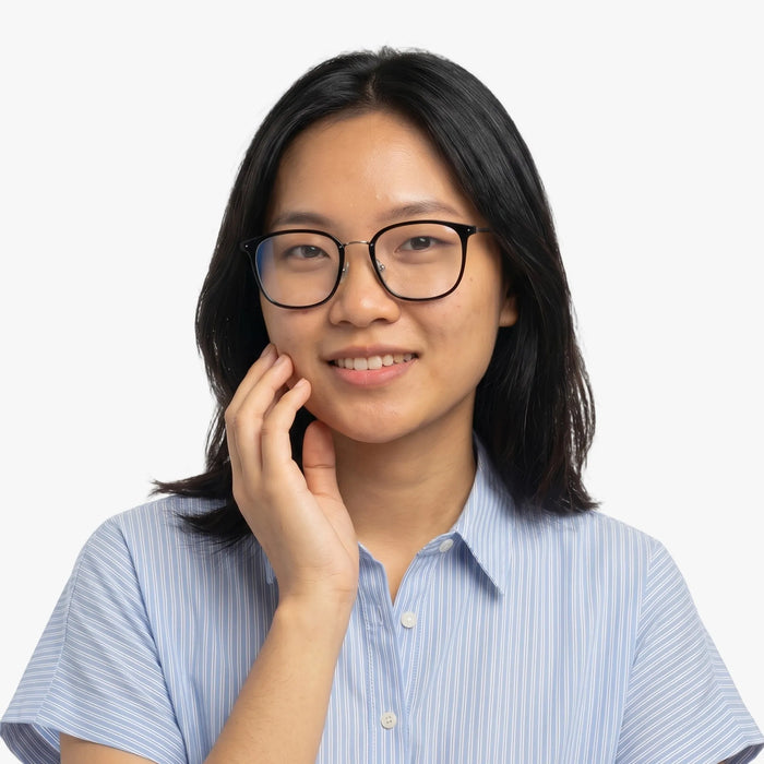 The Eydology Aubrie series of black silver frames accentuate a woman's graceful unique charm.