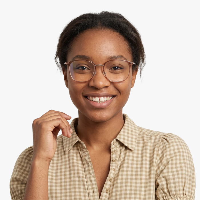 The Eydology Aubrie series of clear grey brown frames accentuate a woman's graceful unique charm.