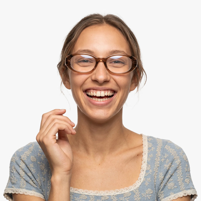 The Eydology Bailey series of brown frames accentuate a woman's graceful unique charm.