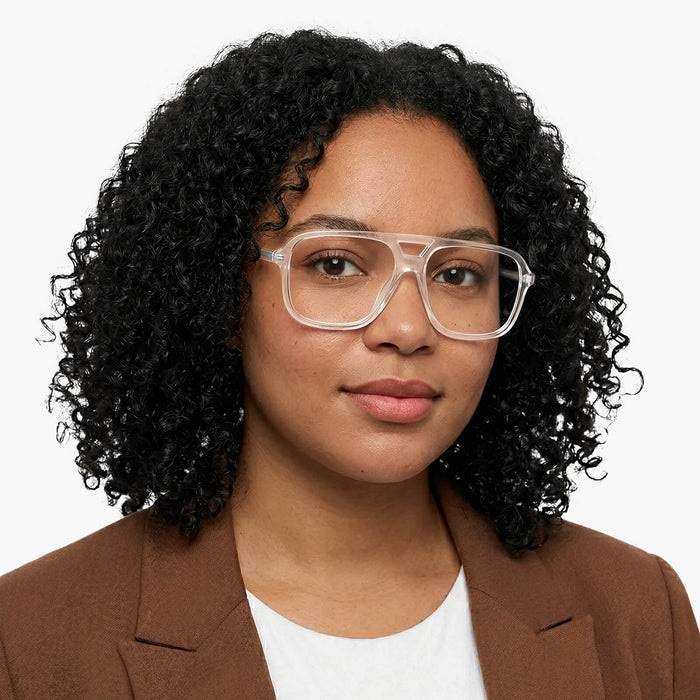 The Eydology Berkley series of clear aviator frames accentuate a woman's fresh bright grace.
