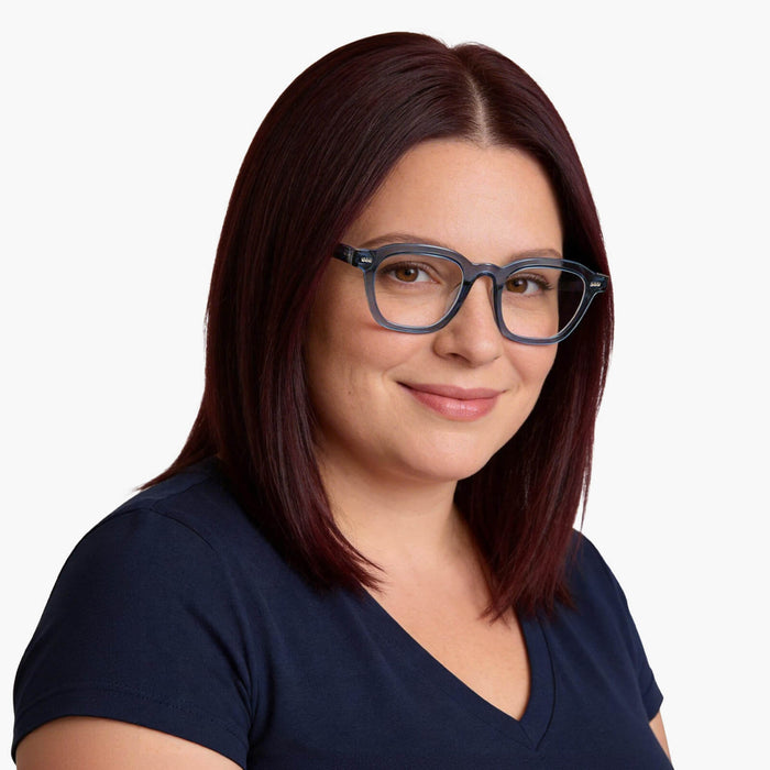 The blue square frames from the Eydology Crystal series accentuate a woman's elegance and sophistication.