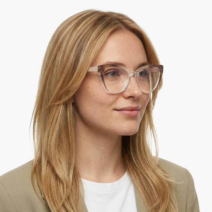 The Eydology Fatima series of gradient brown frames accentuate a woman's gentle refined elegance.