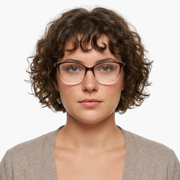 The eydology adriel series of gradient rose purple square frames accentuate a woman's gentle grace.