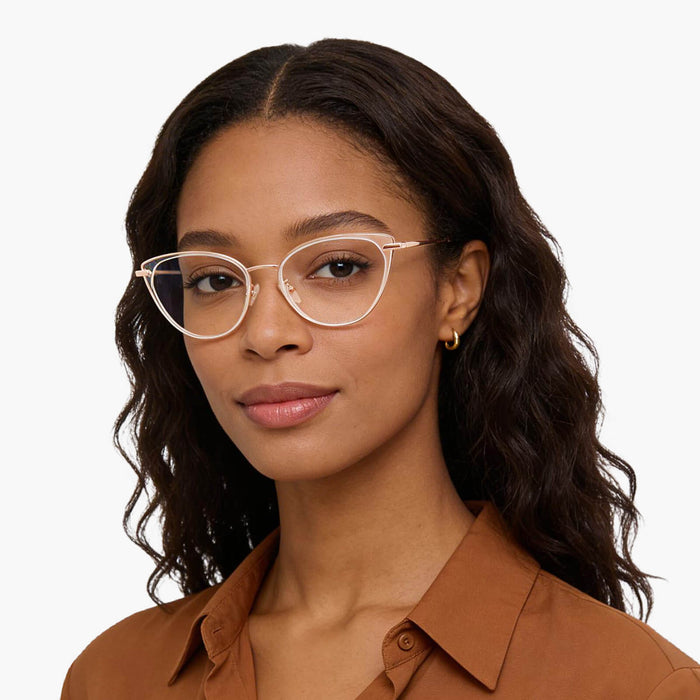 The Eydology Irene series of clear rose gold frames accentuate a woman's confident poise.