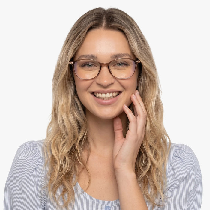 The Eydology Jax series of light brown frames accentuate a woman's graceful unique charm.