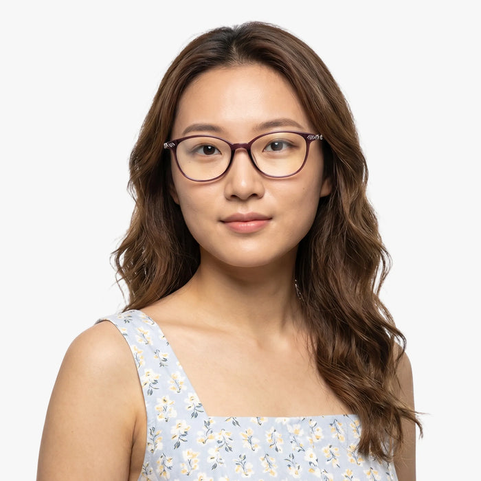 The Eydology Jax series of purple frames accentuate a woman's graceful unique charm.