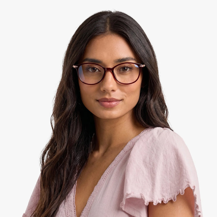 The Eydology Jax series of red frames accentuate a woman's graceful unique charm.