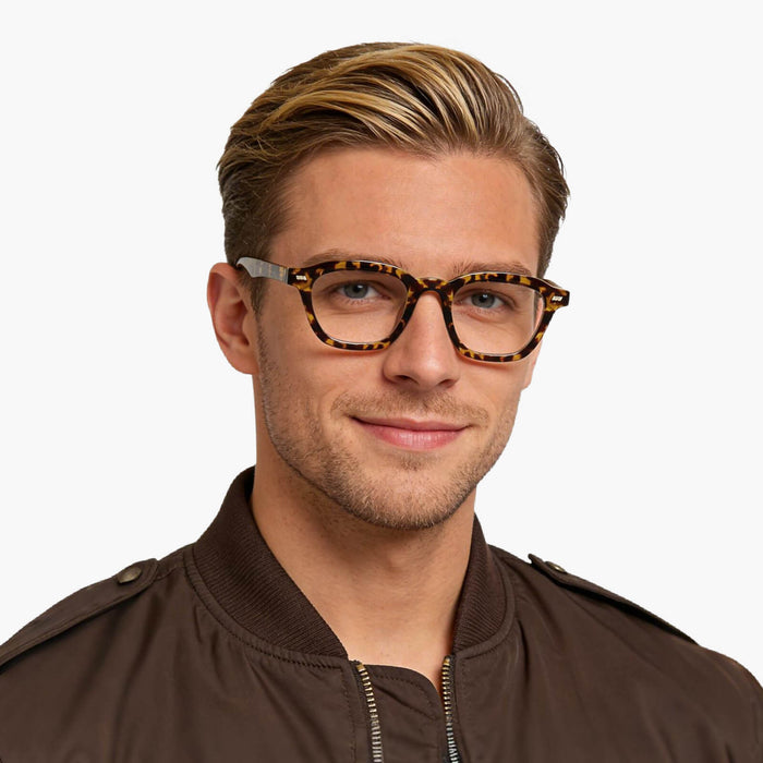 The Eydology Collin series in tortoise showcases unique square frames that enhance a calm, versatile aura for every wearer.