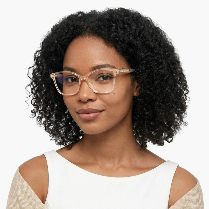 The eydology adriel series of transparent champagne square frames accentuate a woman's elegant grace.