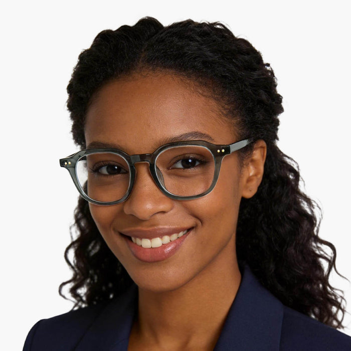 The Eydology Quentin series of  transparent dark blue square frames accentuate a woman's confidence and poise.