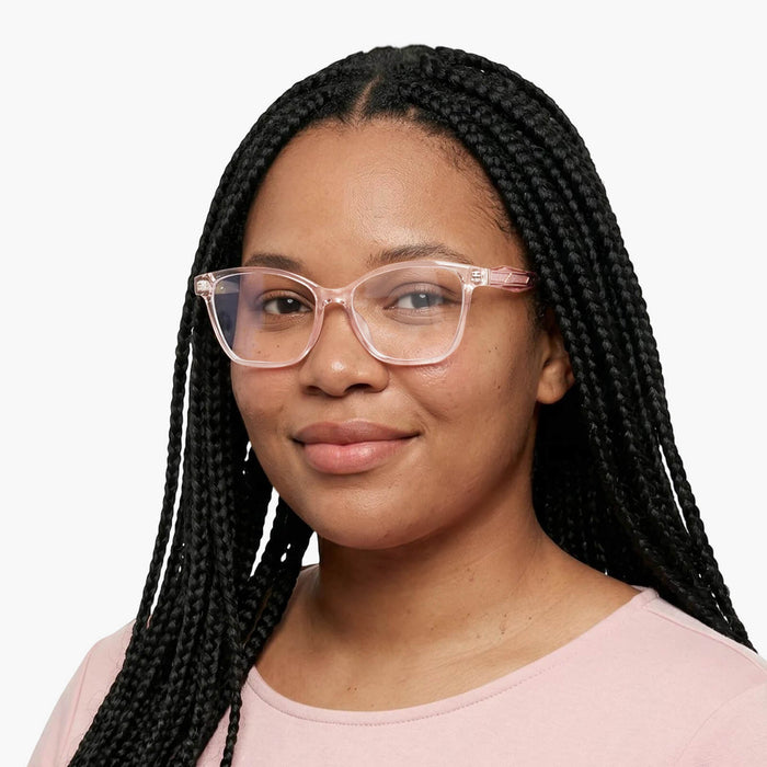 The eydology adriel series of transparent pink square frames accentuate a woman's sunny vitality.